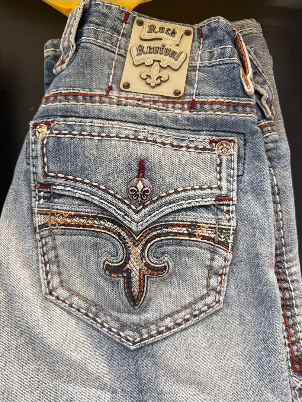 Rock Revival Men’s Light Wash Blue Bootcut Jeans with Embroidered Back Pocket